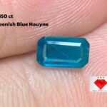 Exploring the Beauty of a 0.450ct Greenish-Blue Hauyne: Emerald Cut Masterpiece