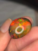 AIG Certified Full Fire 27.71 CT Black Ethiopian Opal - Image 4