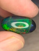 Beautiful 8.51 CT Black Ethiopian Opal Gemstone with Exceptional Presence - Image 10